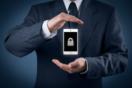 Mobile device (mobile phone, cellphone, tablet) security concept. Protecting gesture of man and symbol of mobile device with padlock.の写真素材