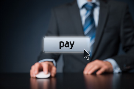 Pay concept - man with virtual computer mouse and button pay. Electronic payment, e-commerce and pay per click (PPC) concept. Focused on button.の写真素材