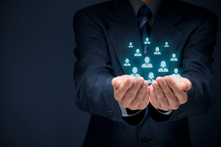 Customer care, care for employees, labor union, human resources pool, life insurance, employment agency and marketing segmentation concepts. Protecting gesture of businessman or personnel and icons representing group of people.の写真素材