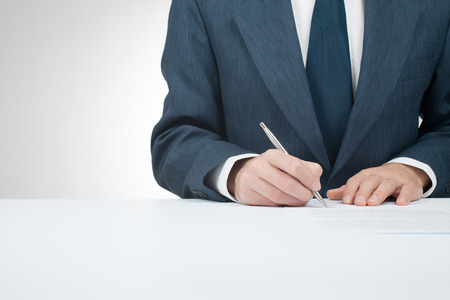 Businessman sign contract, agreement, mortgage, insurance or another documentの写真素材