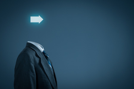 Future in business and business vision concept. Businessman with arrow instead of the head.の写真素材