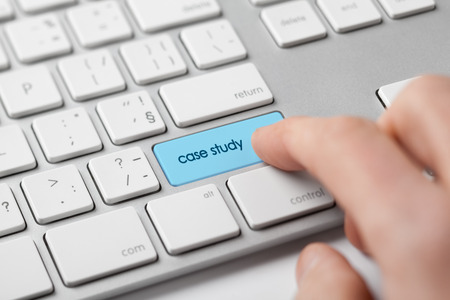 Online case study concept. Businessman click on keypad with text case study.の写真素材