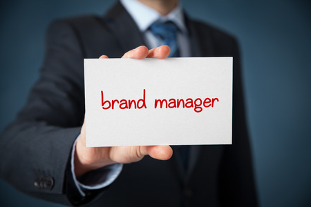 Brand manager advertisement (self-propagation) concept. Man show card with text brand manager.の写真素材