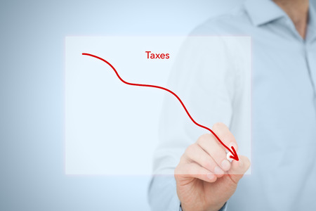 Taxes optimization business concept. Businessman draw simple graph with descending curve.の写真素材