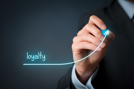 Increase customer or employee loyalty. Businessman draw growing line symbolize growing loyalty.の写真素材