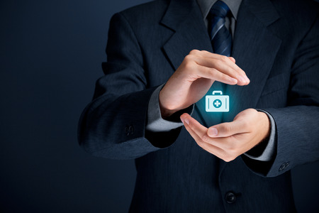 Medical (health) and life insurance concept. Insurance agent with protective gesture and icon of nurse briefcase.の写真素材