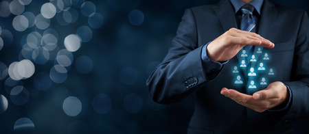 Customer care, care for employees, life insurance and marketing segmentation concepts. Protecting gesture of businessman or personnel and icons representing group of people. Wide banner composition with bokeh background.の写真素材
