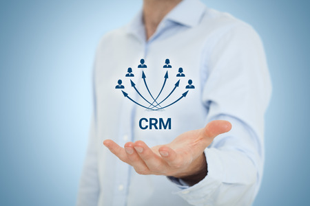 Customer relationship management (CRM) concept. Businessman hold virtual scheme representing CRM.の写真素材