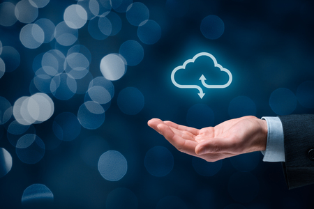 Cloud computing concept - connect to cloud. Hand with cloud computing icon, square composition.の写真素材