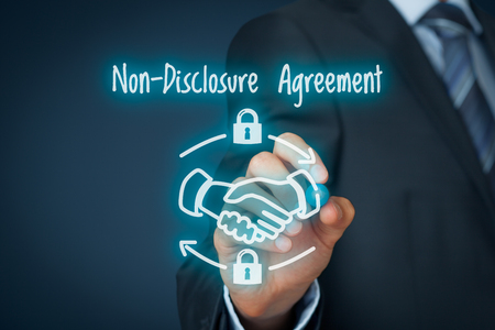 Non-Disclosure Agreement (NDA) business concept. Businessman draw scheme representing Nondisclosure Agreement.の写真素材
