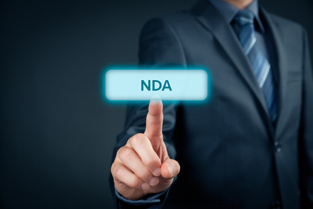 Non-Disclosure Agreement (NDA) business concept. Businessman click on NDA button.の写真素材
