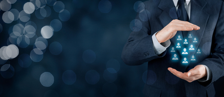 Customer care, care for employees, life insurance and marketing segmentation concepts. Protecting gesture of businessman or personnel and icons representing group of people. Wide banner composition with bokeh background.の写真素材