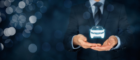 Car (automobile) insurance and car services concept. Businessman with offering gesture and icon of car. Wide banner composition with bokeh in background.の写真素材
