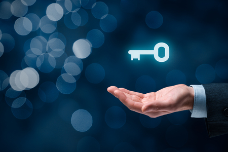Businessman (consultant, coach, leader, CEO or another business person) offer key to success. Turnkey solution and services concept, bokeh in background. Businessman (consultant, coach, leader, CEO or another business person) offer key to success. Turnkey solution and services concept, bokeh in background.