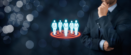 Target audience (marketing) concept. Businessman think about target audience and customers. Wide banner composition with bokeh in background.の写真素材