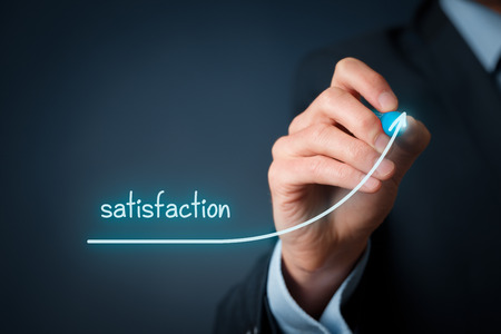 Increase satisfaction in business - customer satisfaction and job satisfaction concept. Businessman (marketing specialist) draw growing line symbolize growing satisfaction.の写真素材