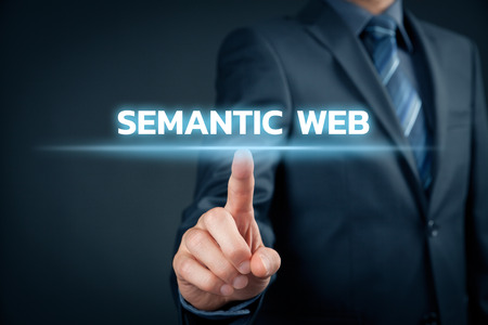 Businessman click on text semantic web (IT buzzword).の写真素材