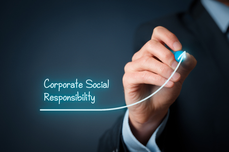 Corporate social responsibility (CSR) concept. Businessman draw improvement graph symbolizing corporate social responsibility improvement.の写真素材
