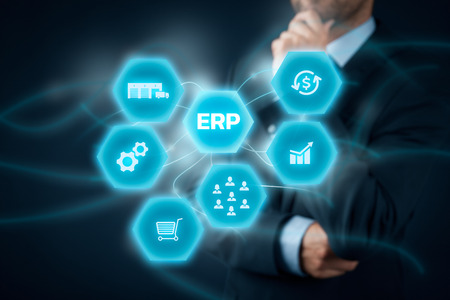 Enterprise resource planning ERP concept. Businessman think about ERP business management software for collect, store, manage and interpret business data like customers, HR, production, logistics, financials and marketing.の写真素材