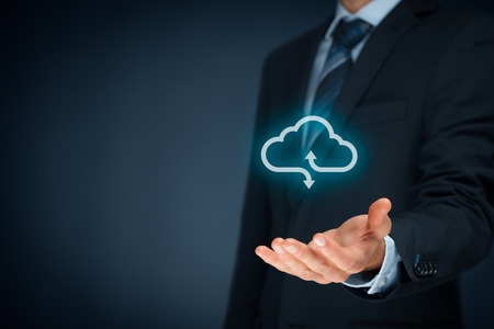 Cloud computing concept - connect your company to cloud. Hand with cloud computing icon.の写真素材
