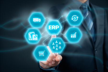 Enterprise resource planning ERP concept. Businessman click on ERP business management software button for collect, store, manage and interpret business data like customers, HR, production, logistics, financials and marketing.の写真素材