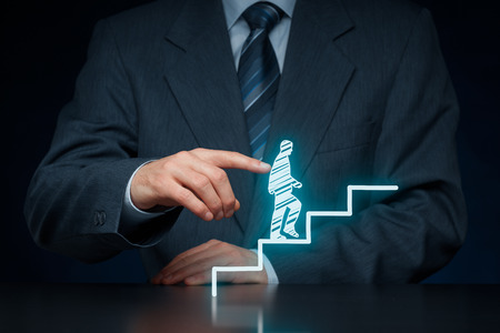 Personal development, personal and career growth, success, progress, motivation and potential concepts. Coach (human resources officer, supervisor) helps employee with his growth.の写真素材