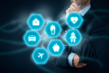 Insurance concept. Businessman (insurance agent, client) think about insurance. Insurance icons: real estate insurance, car insurance, travel insurance, family and life insurance, children's insurance, financial insurance and health insurance.の写真素材