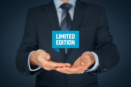 Limited edition business model and marketing offer. Businessman hold virtual label with text limited edition.の写真素材