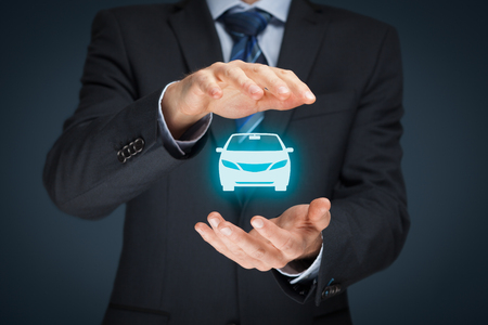Car (automobile) insurance and collision damage waiver concepts. Businessman with protective gesture and icon of car.の写真素材