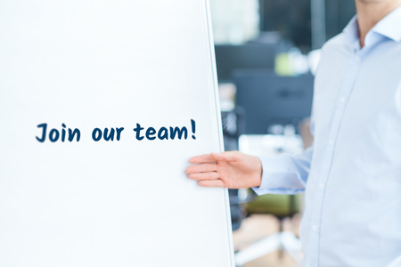 Join our team concept. Businessman (recruiter, HR staffer) attract new employees on company presentation.の写真素材