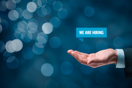 Headhunter (recruiter) hold virtual label with text we are hiring - human resources concept.
の写真素材