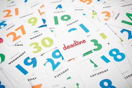 Deadline business concept. Calendar scraps, one with text deadline.
の写真素材