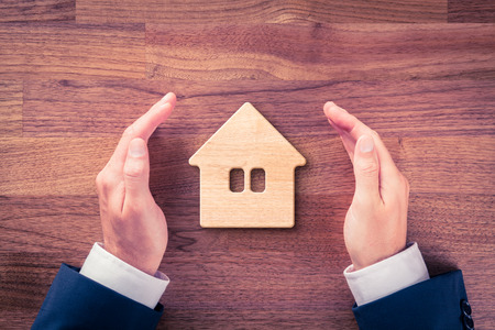 Real estate agent offer house. Property insurance and security concept.の写真素材