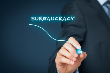 Bureaucracy reduction concept. Businessman draw graph with bureaucracy reduction.の写真素材