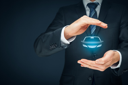 Car (automobile) insurance and collision damage waiver concepts. Insurer (insurance agent) with protective gesture and icon of a car.の写真素材