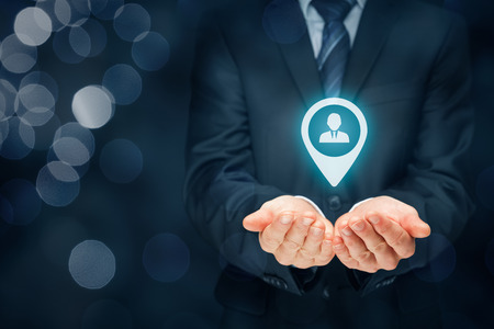 Target customer, customer care and human resources (HR) concept. Businessman hold target customer, employee (or another business person) in hand.の写真素材