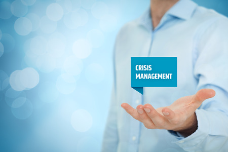 Crisis management service concept. Businessman hold virtual label with text crisis management.の写真素材