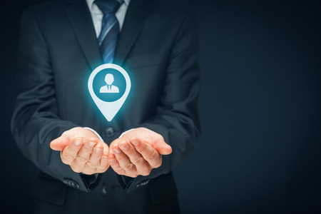 Target customer, customer care and human resources (HR) concept. Businessman hold target customer, employee (or another business person) in hand.の写真素材