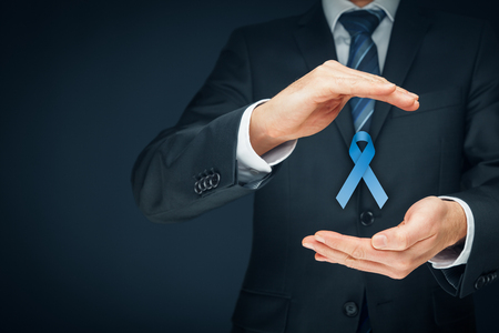 Prostate cancer awareness, peace and genetic disorder awareness - man with protective and support gesture and blue ribbon.の写真素材
