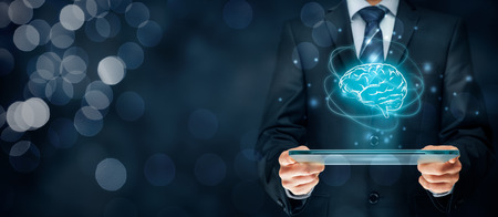 Artificial intelligence (AI), machine deep learning, data mining, expert system software, and another modern computer technologies concepts. Brain representing artificial intelligence and businessman holding futuristic tablet.の写真素材