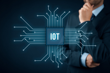 Internet of things (IoT) concept. Businessman think about Internet of Things (IoT). Abstract chip connected with abstract devices represented by points.の写真素材