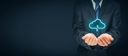 Cloud computing concept - connect devices to cloud. Businessman or information technologist with cloud computing icon.の写真素材