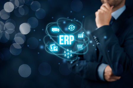 Enterprise resource planning ERP concept. Businessman think about ERP business management software for collect, store, manage and interpret business data about customers, HR, production, logistics, financials and marketing.の写真素材