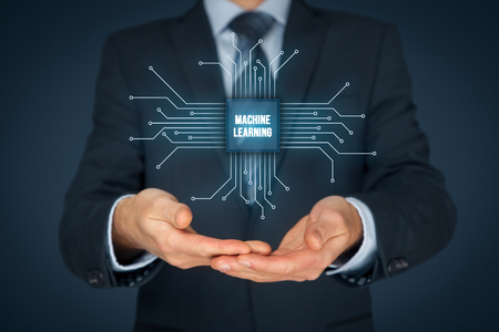 Machine learning data analysis concept. Businessman or programmer with abstract symbol of a chip with text machine learning connected with data represented by points.の写真素材