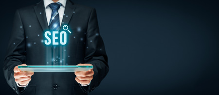 Search engine optimization - SEO concept. Businessman or programmer is focused to improve SEO and web traffic.の写真素材