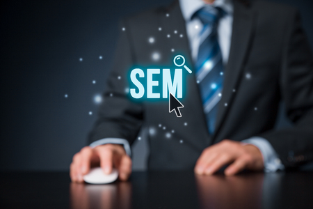 Search engine marketing - SEM concept. Businessman or programmer is focused to improve SEM and web traffic.の写真素材