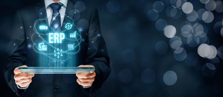 Enterprise resource planning ERP concept. Businessman work with ERP business management software for collect, store, manage and interpret business data about customers, HR, production, logistics, financials and marketing.の写真素材