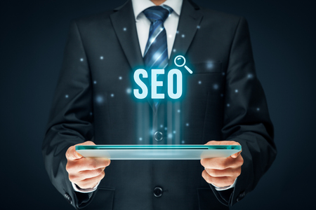 Search engine optimization - SEO concept. Businessman or programmer is focused to improve SEO and web traffic.の写真素材