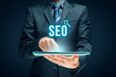 Search engine optimization - SEO concept. Businessman or programmer is focused to improve SEO and web traffic.の写真素材