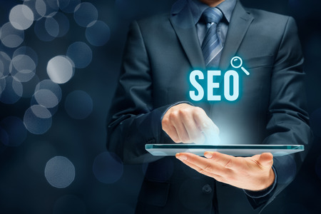 Search engine optimization - SEO concept. Businessman or programmer is focused to improve SEO and web traffic.の写真素材
